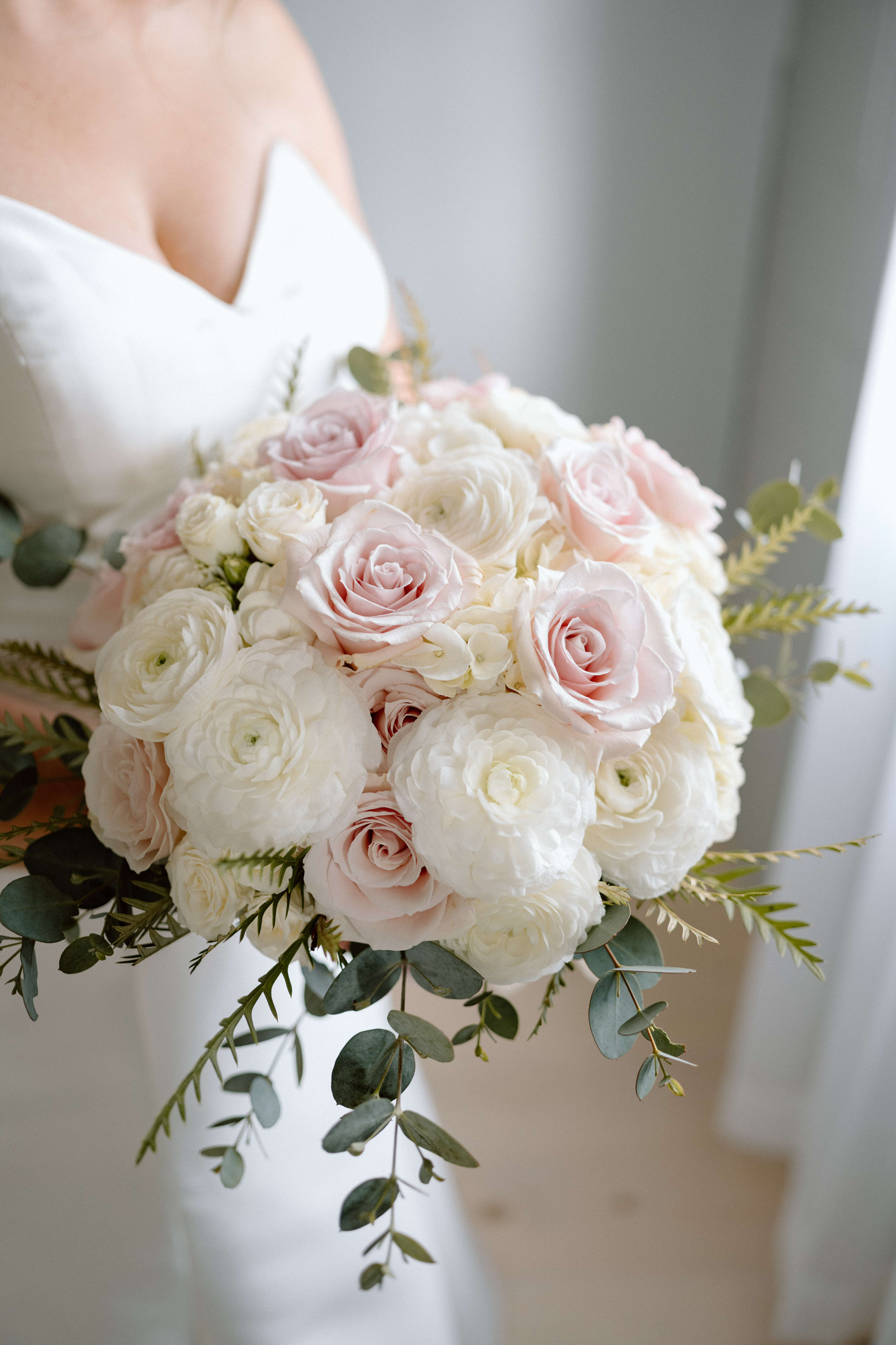 Bridal bouquet with blush pink and white tones.